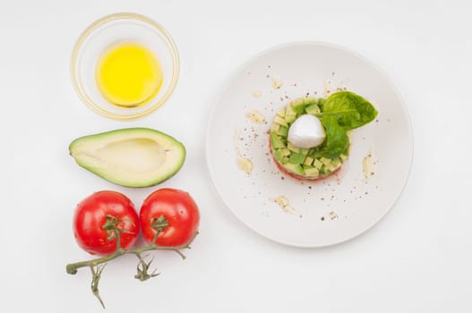 Tomatoes, avocado and olive oil - salad ingridients and salad
