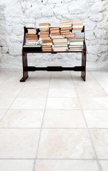 Books on old wooden bench