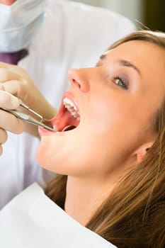Female patient with dentist during treatment