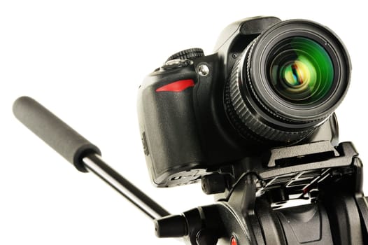 Single-lens reflex camera on tripod isolated on white. SLR