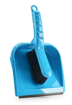 Small plastic broom and shovel isolated on white