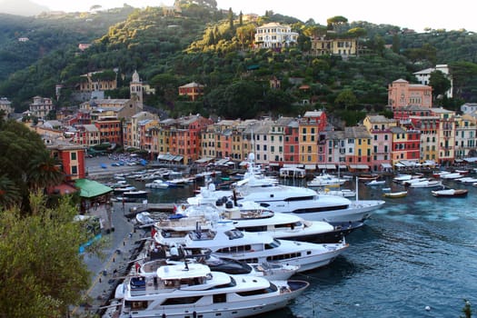 Portofino colors with boats and yatches during the sunset