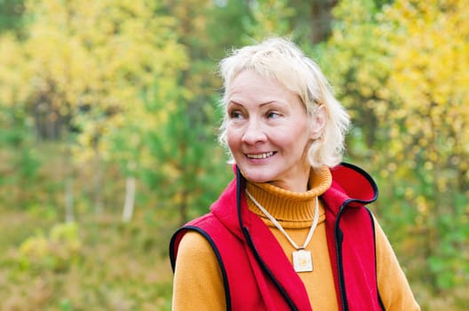 Portrait of a woman middle aged outdoors in fall