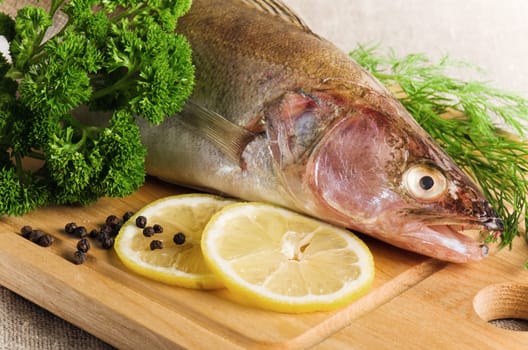 Pike perch on a wooden kitchen board