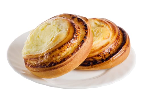 Fresh bread rolls with cheese on a saucer is isolated on white
