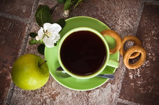 Cup of tea with an apple