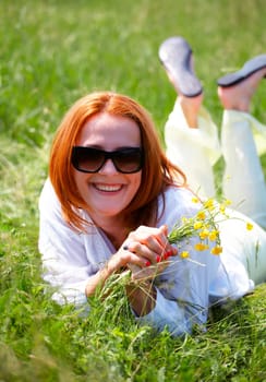 Young caucasian woman enjoying a spring day outdoors.