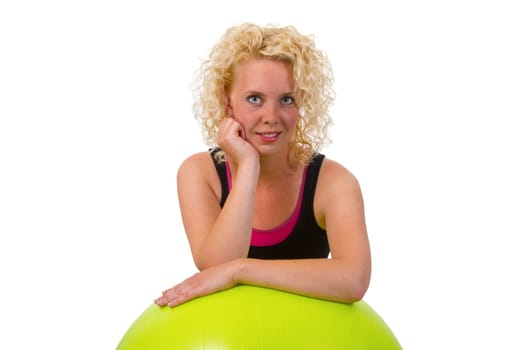Young woman with exercise ball isolated on white background