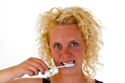 Young woman with toothbrush isolated on white background