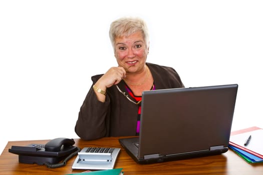 Senior woman using laptop isolated on white background