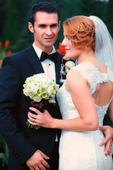 Newly wed couple outdoor on a summer day.