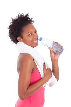 Young african american fitness woman drinking water  over white background
