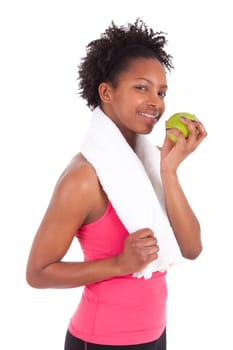 Young african american woman eating  an apple over white background