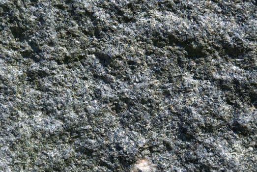 gray granite stone as background or texture