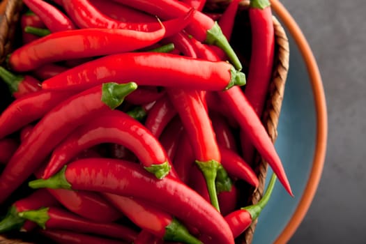 Basket full of raw hot chili peppers.