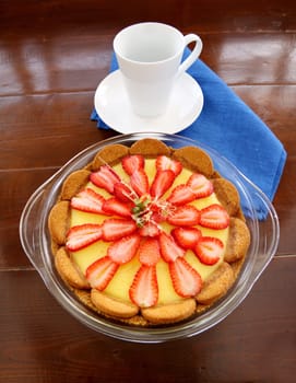 Delightful strawberry custard ginger biscuit tart with toffee garnish ready to serve.