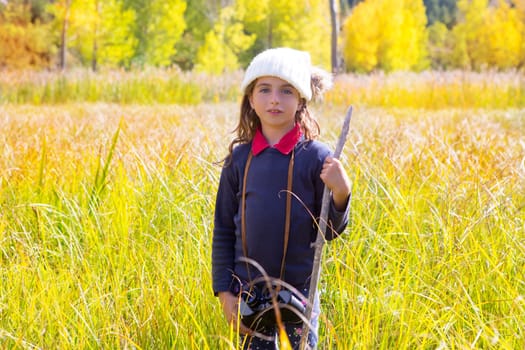 Explorer binocuar kid girl in yellow autumn nature outdoor