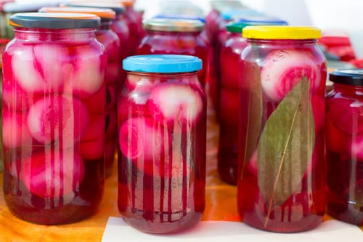 mediterranean pickled onions in red vinegar glass pots traditional tinned food