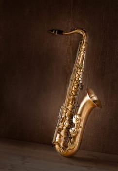 Sax golden tenor saxophone in vintage retro background
