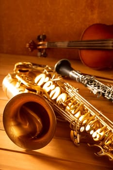 Classic music Sax tenor saxophone violin and clarinet in vintage wood background