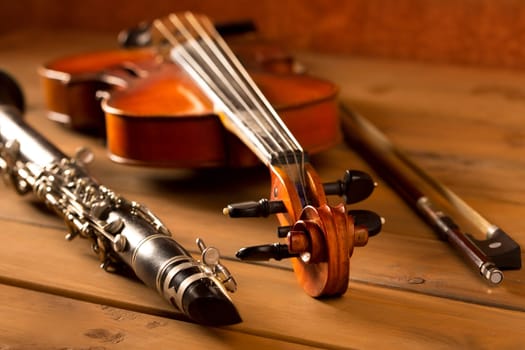 Classic music violin and clarinet in vintage wood background