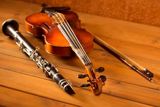 Classic music violin and clarinet in vintage wood background