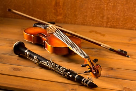 Classic music violin and clarinet in vintage wood background