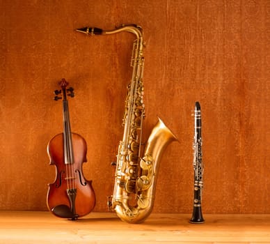 Classic music Sax tenor saxophone violin and clarinet in vintage wood background