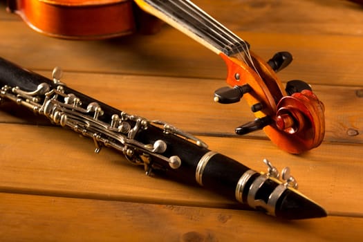 Classic music violin and clarinet in vintage wood background