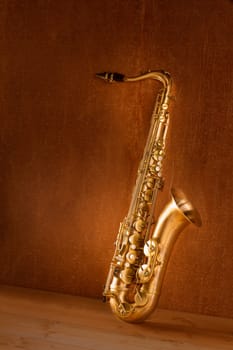 Sax golden tenor saxophone in vintage retro background