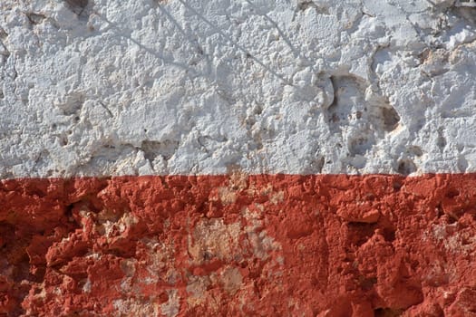 Aged whitewashed wall with red grunge paint wheatered