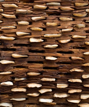 threshing board for wheat of aged wood and stones texture vintage pattern