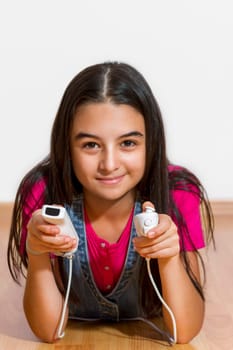 A teenage girl playing video game, isolated on white background