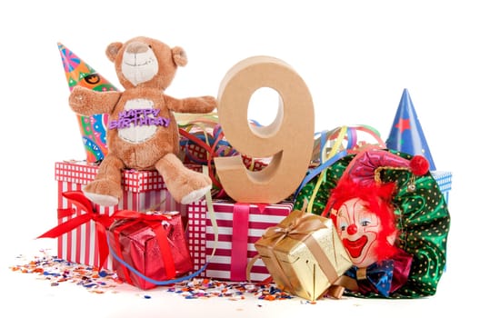 Number of age in a colorful studio setting with a red heart and gifts and tulips