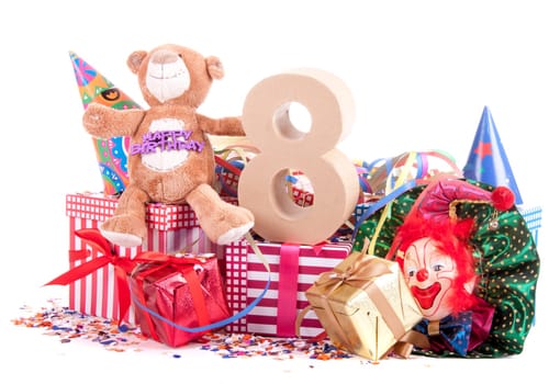 Number of age in a colorful studio setting with a red heart and gifts and tulips