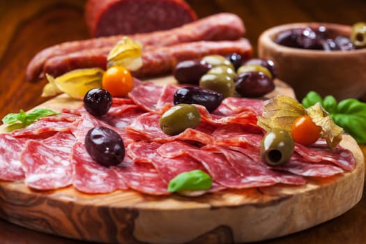 Italian salami with olives and herbs