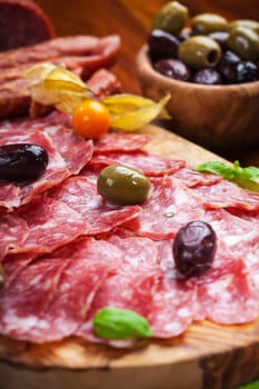 Italian salami with olives and herbs