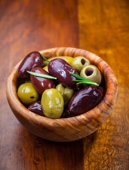 Green and black olives in the bowl
