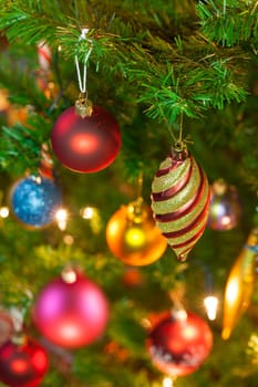 Beautiful traditional christmas decorations on an illuminated xmas tree