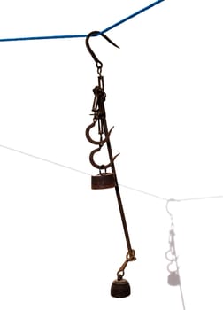 Antique scales rusted iron with weights on white with shadow