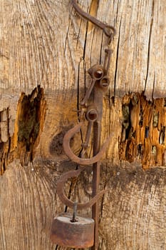 Antique scales rusted iron with weights on vintage background