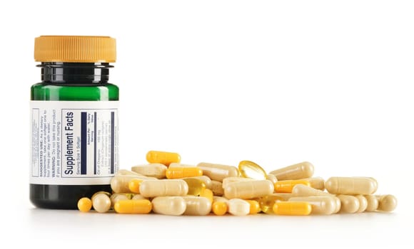 Composition with dietary supplement capsules. Drug pills