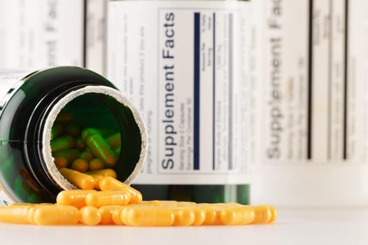 Composition with dietary supplement capsules. Drug pills