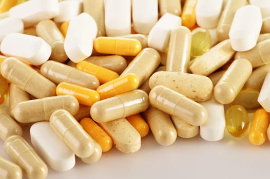 Composition with dietary supplement capsules. Drug pills