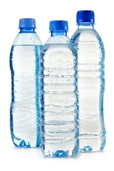 Composition with polycarbonate plastic bottles of mineral water isolated on white background