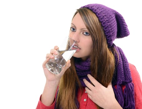 Close-up of sick pretty girl drinking water from glass