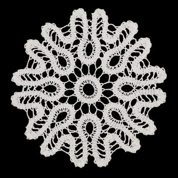 White handmade lace (round form), isolated on black.