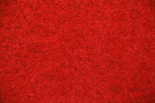 a red background with a structure of a towel