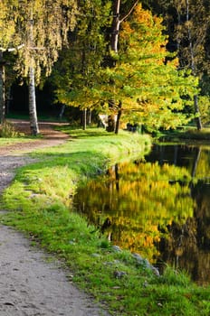 Autumn park with a pond
