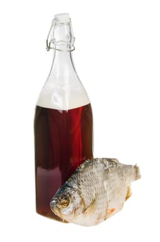 A bottle of domestic beer and dried fish is isolated on white